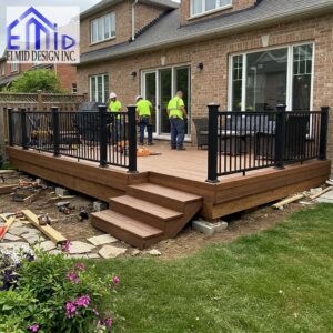 Construction team finalizing a backyard deck in Richmond Hill, demonstrating proper compliance with deck permit requirements.