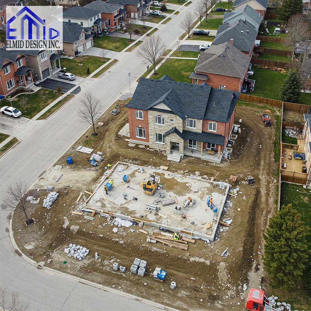 Infill residential construction site in Markham Ontario showing foundation work, heavy machinery, and early grading activities.